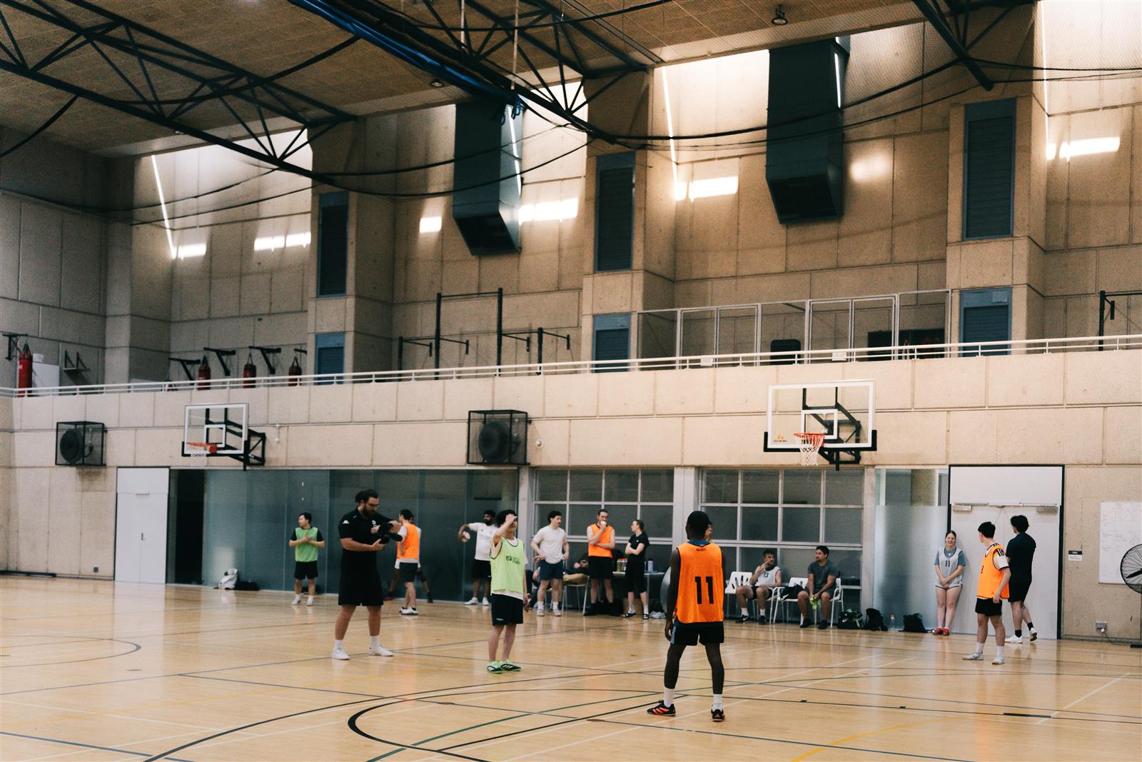 Players on the indoor court at TAFE South Bank during a BK Futsal social session